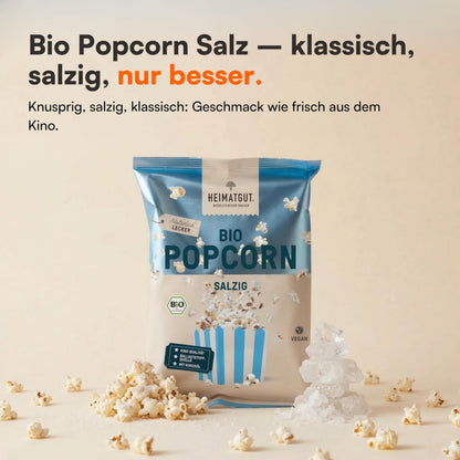 Tüte Bio Popcorn Salzig 60g von Heimatgut neben grobem Meersalz